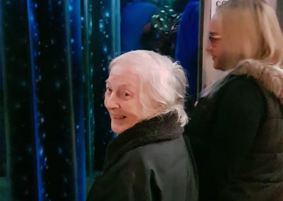 A resident from Lukestone Care Home enjoying a light display at Hop Farm