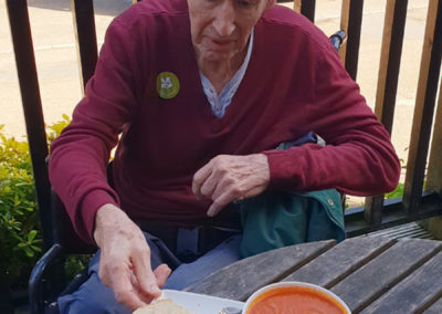 Lukestone resident eating a lunch of homemade soup and bread at the Landemare café