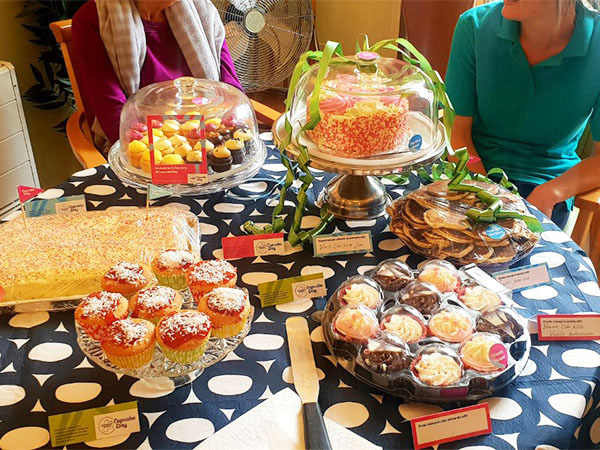 A table full of cupcakes, cakes and biscuits at Lukestone Care Home