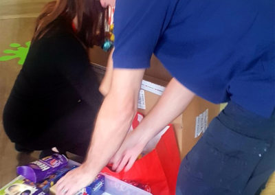 Staff sorting out Easter eggs to donate to Demelza House Hospice