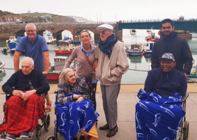 A group of residents and staff outside at Folkestone harbour