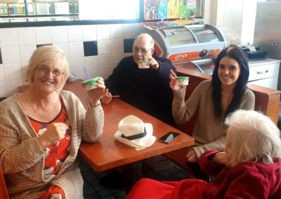 Lukestone staff and residents eating ice-creams in a cafe