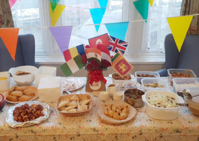 A table of cuisine from around the world, with relevant flags for decoration