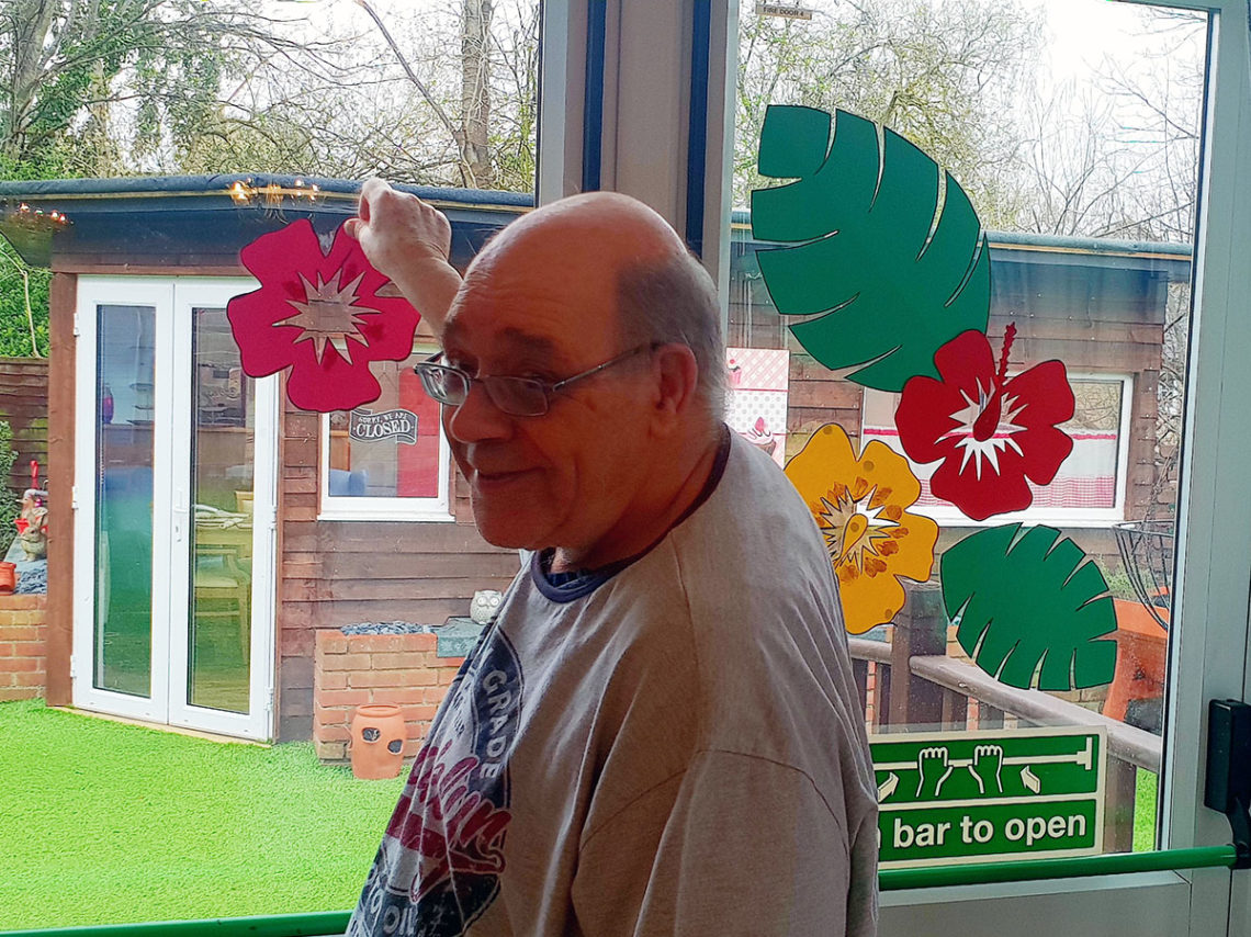Colourful party decorations brighten up the lounge ta Lukestone Care Home