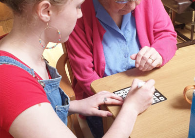 NCS member and resident playing bingo together