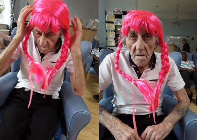 Male resident wearing a bright pink wig at Lukestone Care Home