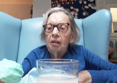 Lukestone Care Home resident mixing some slime ingredients