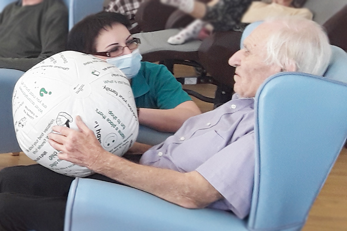 Lukestone Care Home resident and staff member paying with a Toss and Talk ball