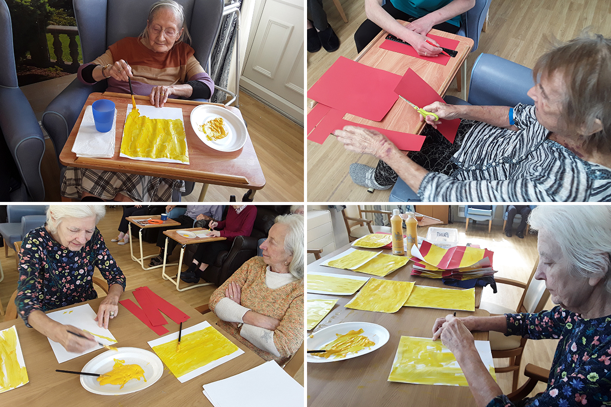Residents painting Spanish flags at Lukestone Care Home