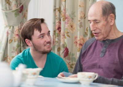Our Activities Co-ordinator Dominic having a chat with one of our residents
