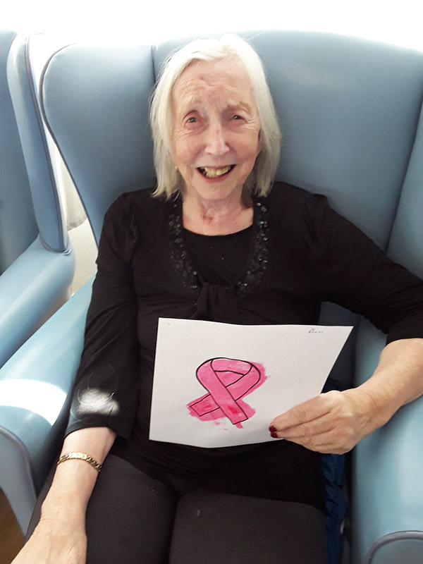 Lukestone Care Home resident with her Breast Cancer pink ribbon painting