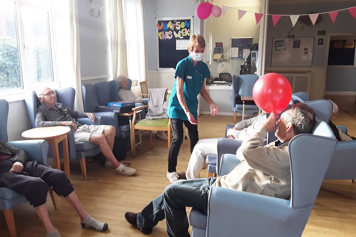 Lukestone Care Home staff and residents enjoying balloon volleyball